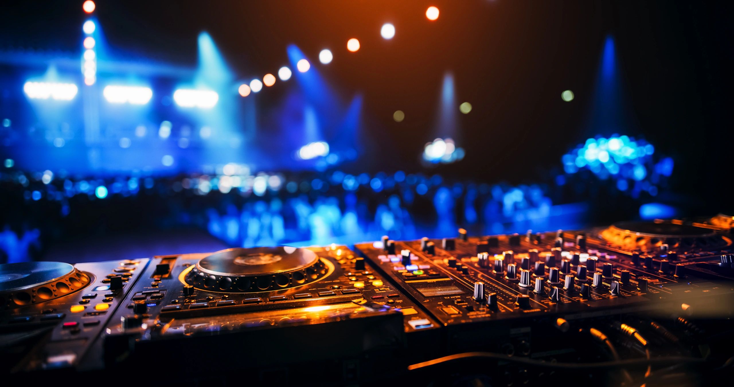 Professional DJ equipment on a club stage